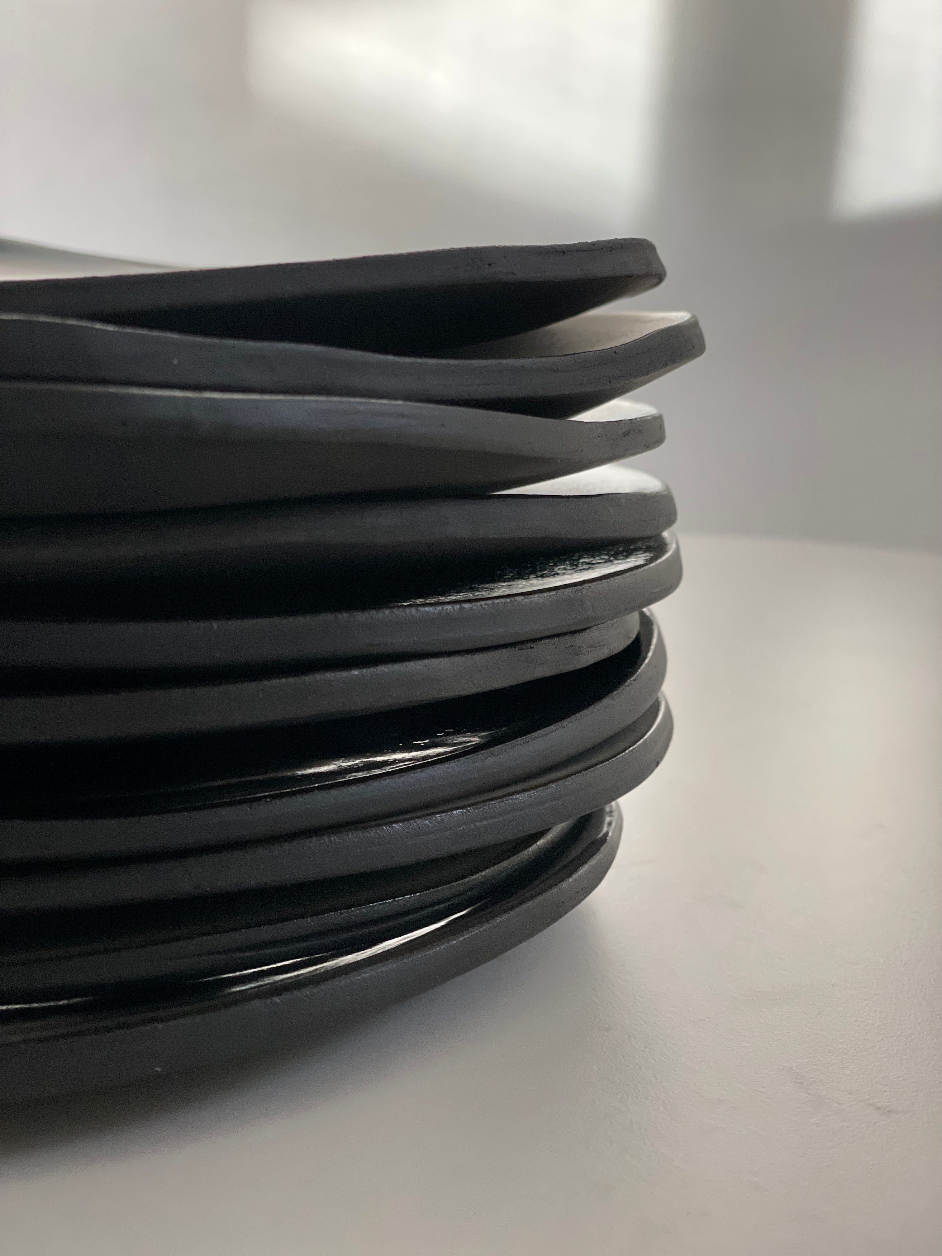 Stack of plates in black clay